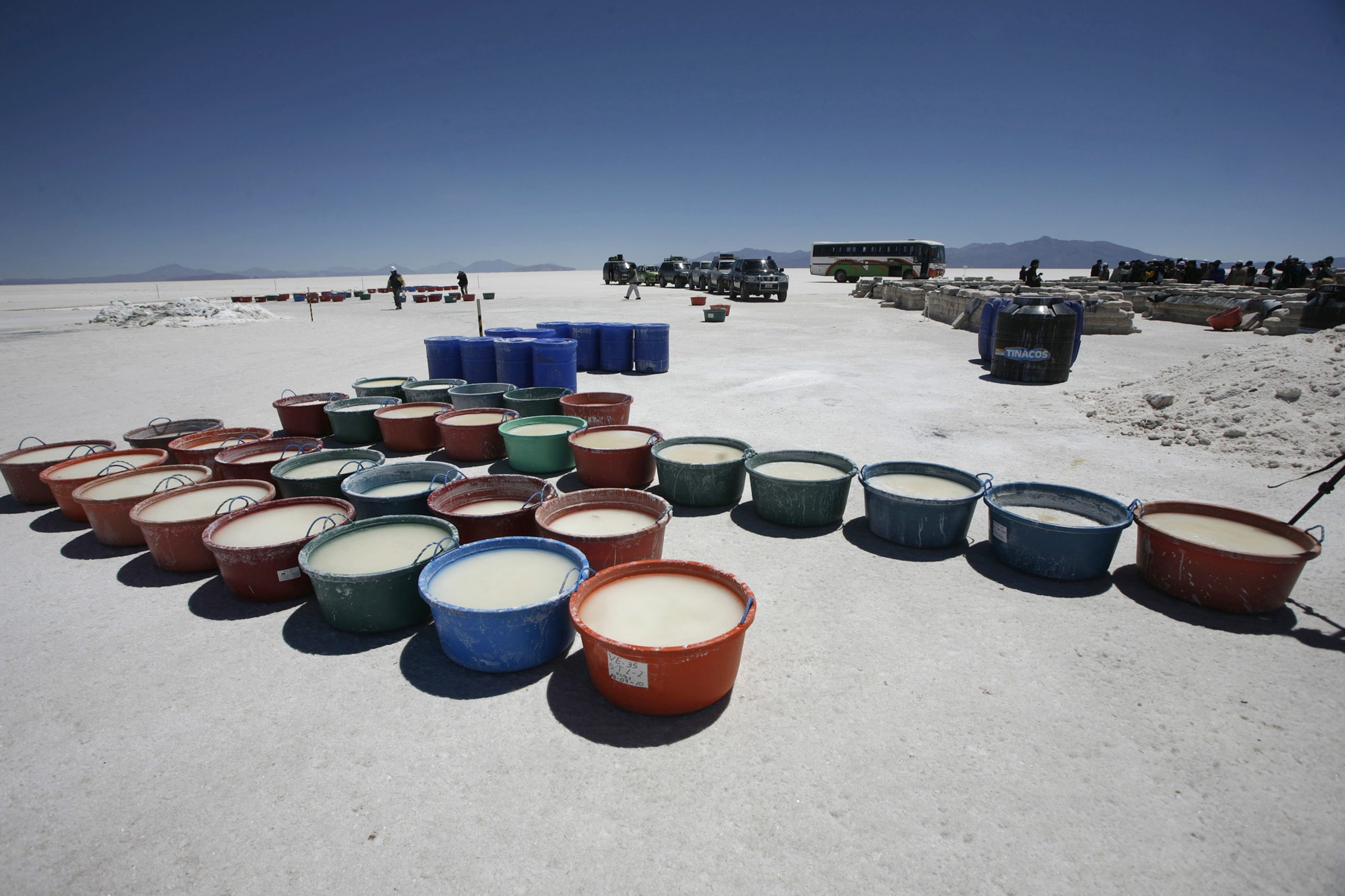 Containers of brine to extract lithium are seen at the Uyuni salt lake