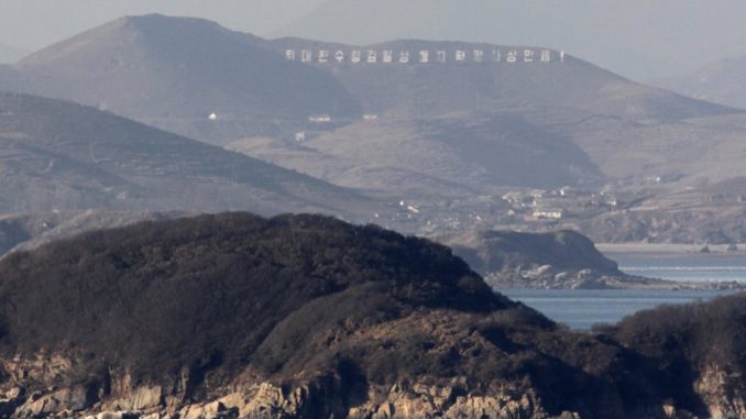 The North Korean county of Kangnyong, believed to be firing positions of artillery shells fired, is seen from South Korean island of Yeongpyeong