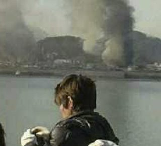 Smoke rises from South Korean Yeonpyeong Island after being hit by dozens of shells fired by North Korea