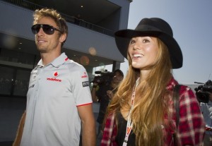 McLaren F1 driver Jenson Button of Britain and his girlfriend Jessica Michibata arrive at the Suzuka circuit