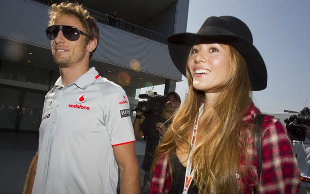 McLaren F1 driver Jenson Button of Britain and his girlfriend Jessica Michibata arrive at the Suzuka circuit