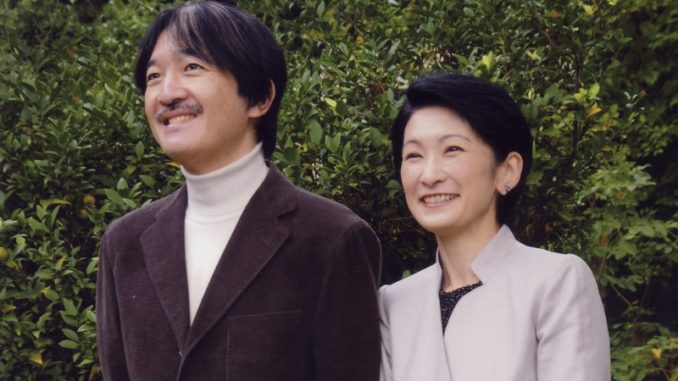 Prince Akishino and his wife, Princess Kiko, stand together in the Akasaka Imperial Palace compound in Tokyo