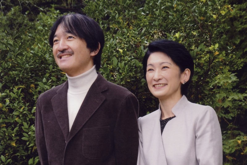 Prince Akishino and his wife, Princess Kiko, stand together in the Akasaka Imperial Palace compound in Tokyo