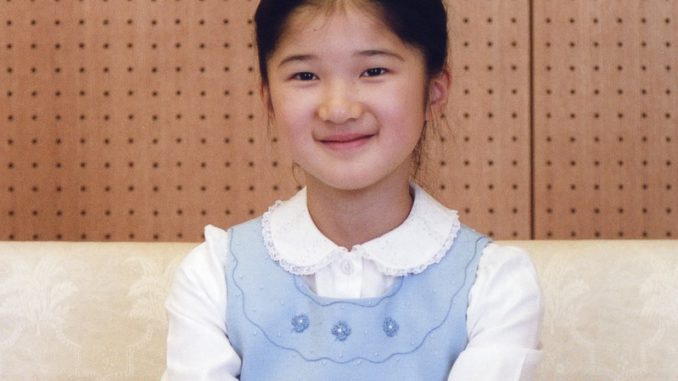 Japan's Princess Aiko smiles at her Togu Palace residence in Tokyo in this handout photo