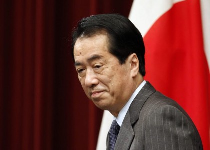 Japanese Prime Minister Naoto Kan arrives at a news conference in Tokyo