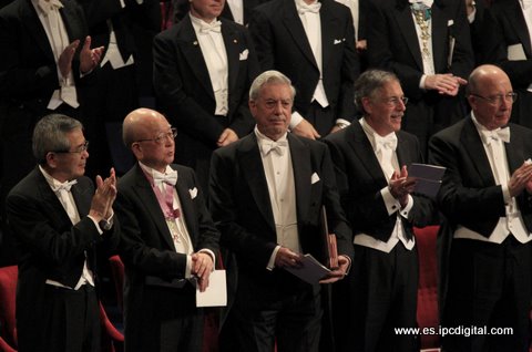 Mario Vargas Llosa of Peru winner of 2010 Nobel Prize in Literature is applauded by Chemistry laureates Negishi and Suzuki and Economic Sciences laureates Diamond and his compatriot Mortensen during award ceremony at Concert Hall in Stockholm