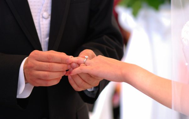 He put the wedding ring on her finger